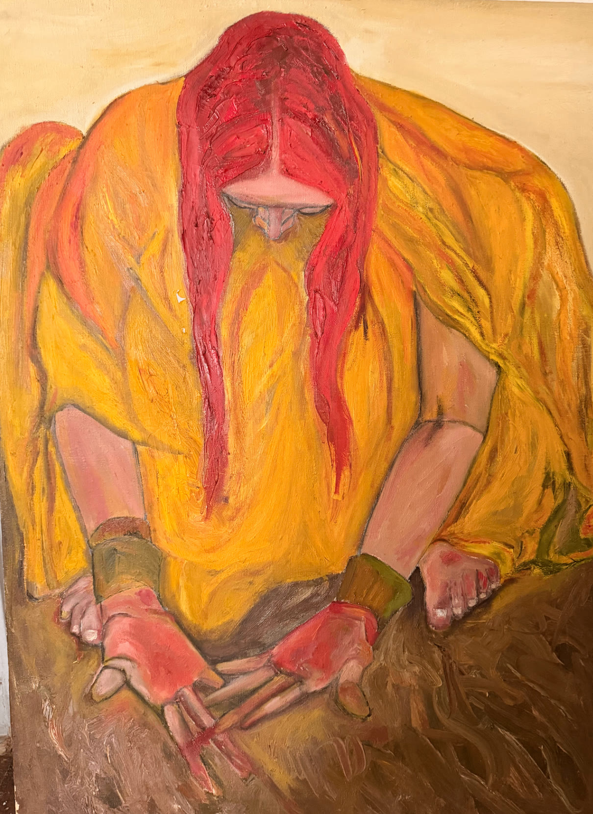 Seated figure in a saffron yellow robe with long auburn hair, hands folded forward, painted in warm oils on linen